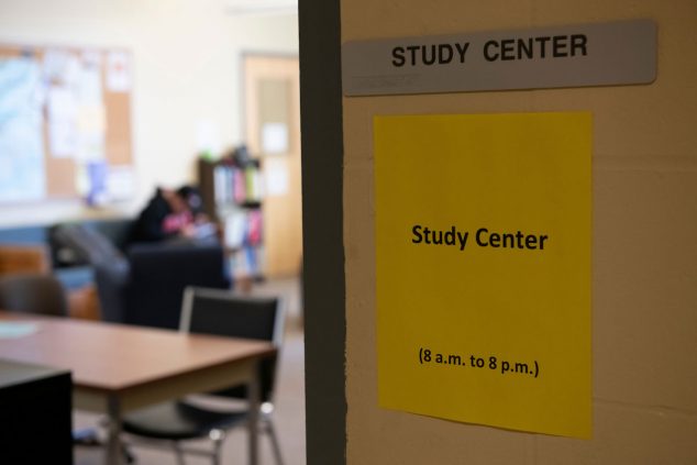 Shows the entrance to the study center and a sign that says "open 8 a.m. to 8 p.m."