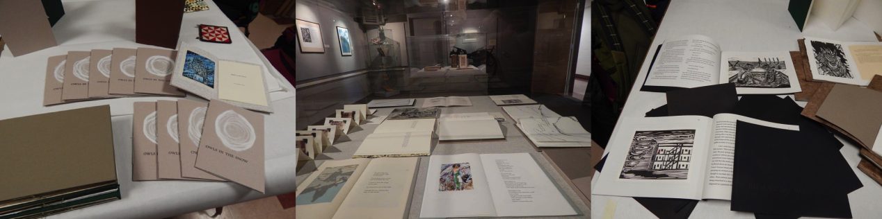 Three photos of artist's books open on gallery tables