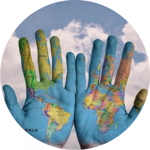 Set of hands painted to look like a map of the world. Link to International Students page.