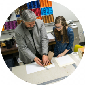 Teach showing a bookbinding technique to a student. Link to Creative Arts pathway.