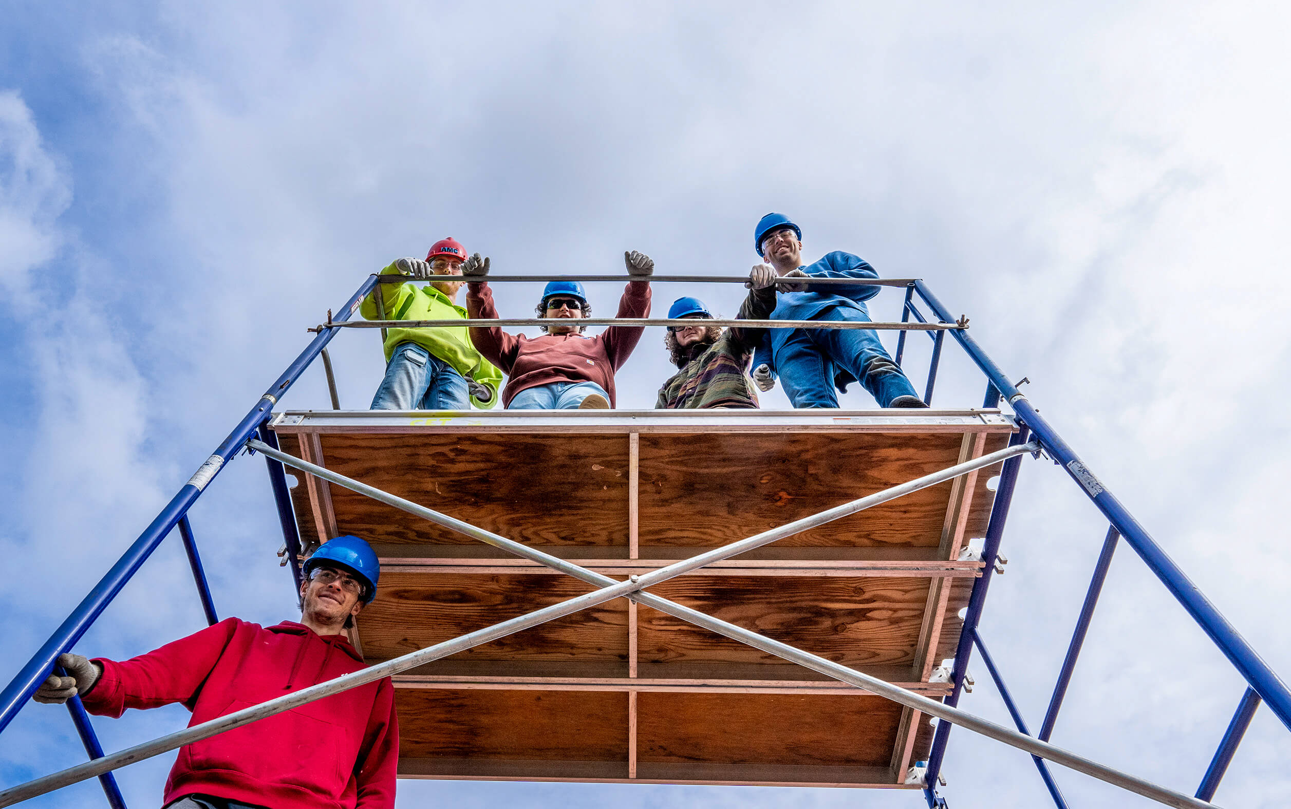 5 Umaine Engineering students practicing building scaffolding