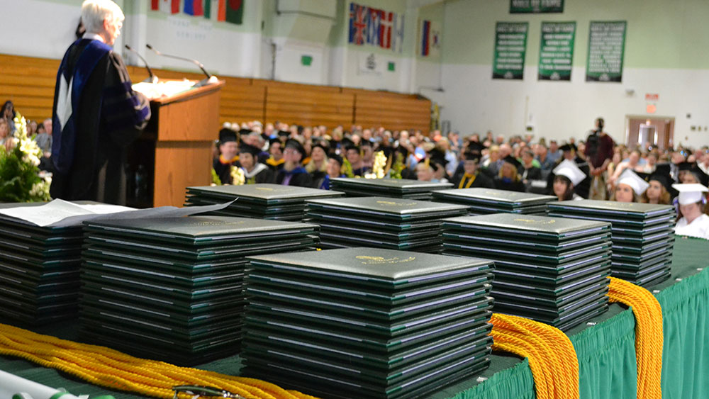 Diplomas stacked at Commencement