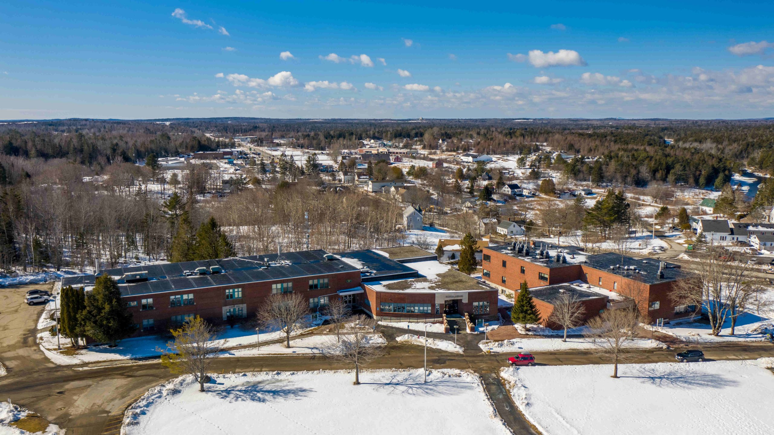 An aerial view of Torrey Hall, Merrill Library and the Science Building in winter