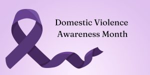 lilac colored background with a large purple ribbon. "Domestic Violence Awareness Month"