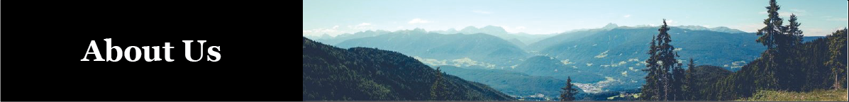 mountains and trees against a blue sky. copy About Us