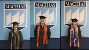 Keely Tibbetts, Evan Busch, and Rachael Smith each pose in front of the blueand white UMaine Machias crest