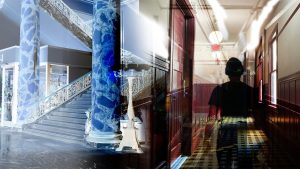 The left side of the photo is a blue and white staircase, while the right side is a shadow of someone walking down a red and brown hallway.