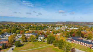 an aerial shot of campus and the town of Machias in the background