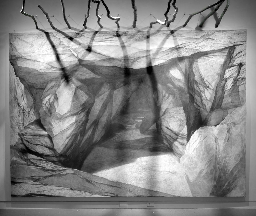 Black and white art piece titled "Cave"