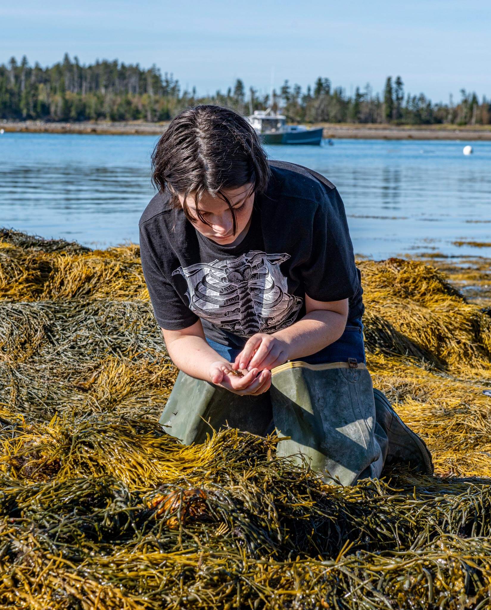 A photo of a student on Maine's coast